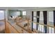 Open-concept living room with high ceilings, large windows, and stylish curtains, perfect for entertaining at 331 Las Lomas St, Brighton, CO 80601