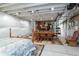 Spacious basement area with an exposed ceiling and framed seasonal decor at 3936 Costillo Ct, Brighton, CO 80601