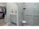 Walk-in shower features built in seat and shelving at 3936 Costillo Ct, Brighton, CO 80601
