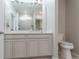 Bathroom boasts double sinks, quartz countertops, and recessed lights at 3936 Costillo Ct, Brighton, CO 80601