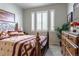 Bedroom filled with natural light from window with shutters at 3936 Costillo Ct, Brighton, CO 80601