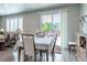 Cozy dining area features wood floors, sliding glass doors, and access to outdoor deck at 3936 Costillo Ct, Brighton, CO 80601
