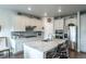 Kitchen with granite countertops, stainless steel appliances, white cabinets and barstool seating at 3936 Costillo Ct, Brighton, CO 80601