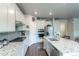 Kitchen with granite countertops, stainless steel appliances and white cabinets at 3936 Costillo Ct, Brighton, CO 80601