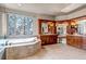 Luxurious bathroom with a large soaking tub and dual vanities at 9132 Scenic Pine Dr, Parker, CO 80134