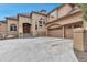 Stunning exterior showcasing a well-maintained three car garage, complemented by a stone facade and ample parking space at 9132 Scenic Pine Dr, Parker, CO 80134