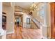 Elegant foyer with a grand staircase, hardwood floors, and soaring ceilings at 9132 Scenic Pine Dr, Parker, CO 80134