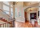 Spacious foyer with hardwood floors, a grand staircase, and abundant natural light at 9132 Scenic Pine Dr, Parker, CO 80134
