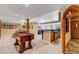 Game room with foosball table, pool table, and wet bar at 9132 Scenic Pine Dr, Parker, CO 80134