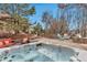 Relaxing hot tub area with flagstone patio, accented by comfortable seating, creating a serene outdoor retreat at 9132 Scenic Pine Dr, Parker, CO 80134