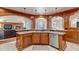 Large kitchen island with granite countertop, sink, and built-in dishwasher at 9132 Scenic Pine Dr, Parker, CO 80134