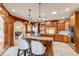 Spacious kitchen featuring wood cabinets, granite counters, and stainless steel appliances at 9132 Scenic Pine Dr, Parker, CO 80134