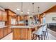 Spacious kitchen with granite countertops, custom cabinets, and stainless steel appliances at 9132 Scenic Pine Dr, Parker, CO 80134