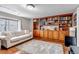 Living room boasts built-in wooden shelves and a large window at 9132 Scenic Pine Dr, Parker, CO 80134