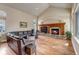 Cozy living room with vaulted ceiling, stone fireplace, and hardwood floors at 9132 Scenic Pine Dr, Parker, CO 80134