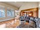 Open living area with hardwood floors seamlessly connected to the kitchen at 9132 Scenic Pine Dr, Parker, CO 80134