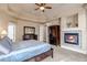 Comfortable main bedroom with fireplace and large closet at 9132 Scenic Pine Dr, Parker, CO 80134