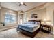 Bright main bedroom with large window, plush carpet, and tray ceiling at 9132 Scenic Pine Dr, Parker, CO 80134