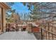 A multi-tiered deck with seating, offering a perfect retreat with serene views and outdoor enjoyment at 9132 Scenic Pine Dr, Parker, CO 80134