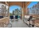 A covered patio with outdoor seating and grill, perfect for entertaining and enjoying the scenic views at 9132 Scenic Pine Dr, Parker, CO 80134