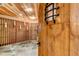 Spacious wine cellar featuring wood racks, unique stone flooring, and a decorative wood door at 9132 Scenic Pine Dr, Parker, CO 80134