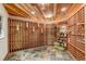 Beautiful wine cellar with ample wood storage racks, stone flooring, and decorative lighting at 9132 Scenic Pine Dr, Parker, CO 80134