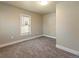Bedroom with cozy carpet, neutral paint, and a window offering plenty of natural light at 915 N Irving St, Denver, CO 80204