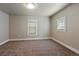 Bedroom with neutral carpet and paint, featuring two windows allowing natural light to enter at 915 N Irving St, Denver, CO 80204
