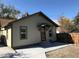 Charming exterior of a cozy home with a well-maintained yard and covered front entry at 915 N Irving St, Denver, CO 80204