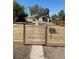 Charming home featuring a modern horizontal wood fence with metal accents and visible street address at 915 N Irving St, Denver, CO 80204