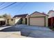 Detached garage with a large parking pad at 915 N Irving St, Denver, CO 80204