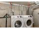 A dedicated laundry room with modern Samsung washer and dryer for convenient home care at 915 N Irving St, Denver, CO 80204