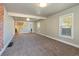 Spacious living room with neutral carpet, fresh paint, and natural light at 915 N Irving St, Denver, CO 80204