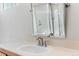 Bathroom vanity featuring a single sink, white countertop, and neutral tile backsplash at 14794 Vine St, Thornton, CO 80602