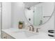 Bathroom featuring a walk-in shower with glass door and round mirror at 14794 Vine St, Thornton, CO 80602