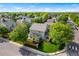 Exterior view showcasing a well-kept lawn, mature trees, a fenced yard, and sidewalks on a quiet street at 14794 Vine St, Thornton, CO 80602