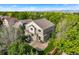 An exterior shot of the 2-story home reveals a patio, mature trees, and a well-maintained yard, ideal for relaxation at 14794 Vine St, Thornton, CO 80602