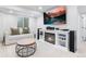 Living room featuring a TV above a fireplace and a white couch at 14794 Vine St, Thornton, CO 80602