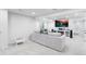 Spacious living room features white couches, TV, and modern decor at 14794 Vine St, Thornton, CO 80602