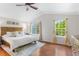 Inviting main bedroom featuring large windows and hardwood floors at 14794 Vine St, Thornton, CO 80602