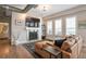 Comfortable living room features a fireplace, built in shelving, hardwood floors and plenty of natural light at 10111 Inverness Main St # 301, Englewood, CO 80112