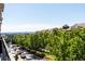 Scenic view of the neighborhood with tree-lined streets and distant airport from a balcony at 10111 Inverness Main St # 301, Englewood, CO 80112