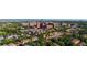 This aerial view showcases a neighborhood with townhomes and lush greenery at 221 S Garfield St # 213, Denver, CO 80209