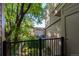 Private balcony overlooking lush greenery and surrounding neighborhood at 221 S Garfield St # 213, Denver, CO 80209