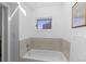 Bathroom with tub and tiled walls at 221 S Garfield St # 213, Denver, CO 80209