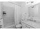 This bathroom has white tile in the shower and a modern marble vanity at 221 S Garfield St # 213, Denver, CO 80209