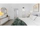Bedroom view featuring vanity, closet, and ensuite bathroom. Decor includes modern mirror and botanical art at 221 S Garfield St # 213, Denver, CO 80209