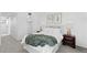 Well-lit bedroom showcases natural light, decorative side tables, closet, comfortable bed, and botanical art at 221 S Garfield St # 213, Denver, CO 80209