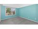 This cozy bedroom features a large window and soothing blue walls at 221 S Garfield St # 213, Denver, CO 80209