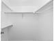 Walk in closet featuring shelving and bars at 221 S Garfield St # 213, Denver, CO 80209
